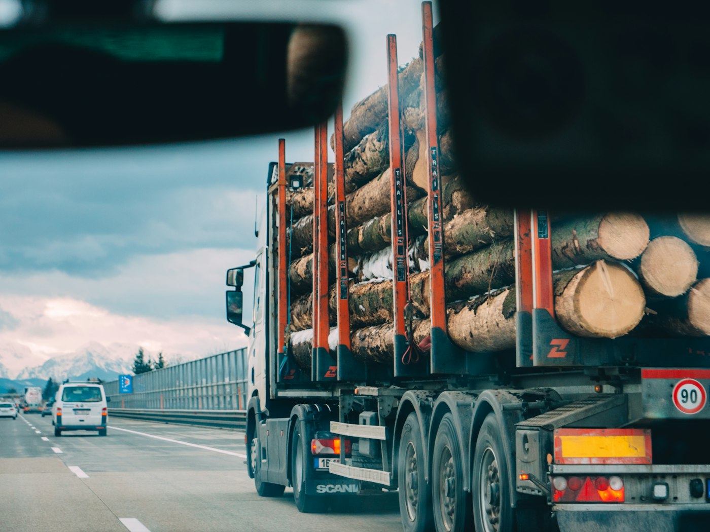 Log truck hauling harvested timber